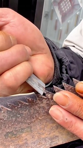 Carefully Sharpening the Teeth of a Hand Saw Using a Small Metal File #shorts